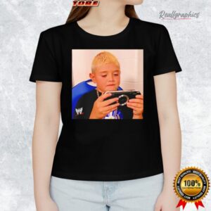 dominik mysterio wearing his younger self playing the psp shirt 1 ks8dm5